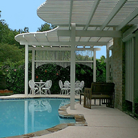 photo of decorative lattice, pergola patio cover over decorative patio and pool.